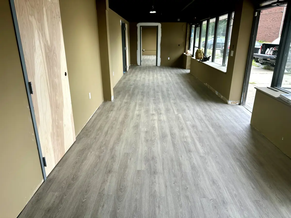 Modern vinyl plank flooring installation commercial space